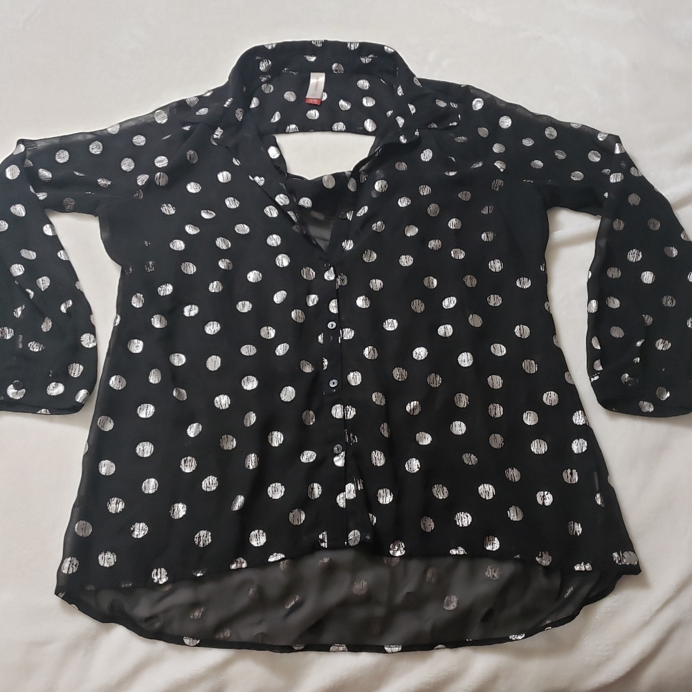 Black top with shiny silver circles.